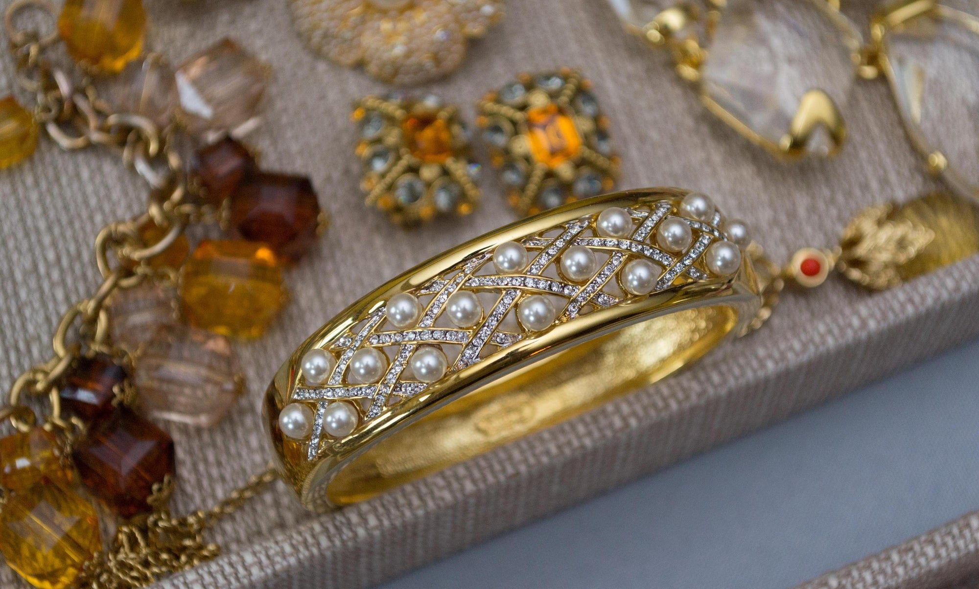 Vintage Camrose and Kross JBK Jacqueline Bouvier Kennedy Gold Pearl and Rhinestone Bangle Bracelet by Camrose and Kross JBK Jacqueline Bouvier Kennedy - Vintage Meet Modern Vintage Jewelry - Chicago, Illinois - #oldhollywoodglamour #vintagemeetmodern #designervintage #jewelrybox #antiquejewelry #vintagejewelry