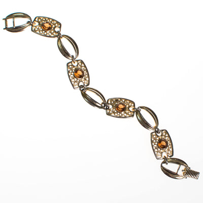 Sarah Coventry Amber Topaz Crystal and Filigree Link Panel Bracelet by Sarah Coventry - Vintage Meet Modern Vintage Jewelry - Chicago, Illinois - #oldhollywoodglamour #vintagemeetmodern #designervintage #jewelrybox #antiquejewelry #vintagejewelry