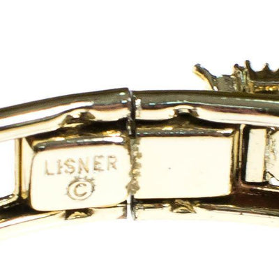 Vintage Lisner Hinged Bangle Bracelet with Emerald Green and Aurora Borealis Rhinestones by Lisner Hinged - Vintage Meet Modern Vintage Jewelry - Chicago, Illinois - #oldhollywoodglamour #vintagemeetmodern #designervintage #jewelrybox #antiquejewelry #vintagejewelry