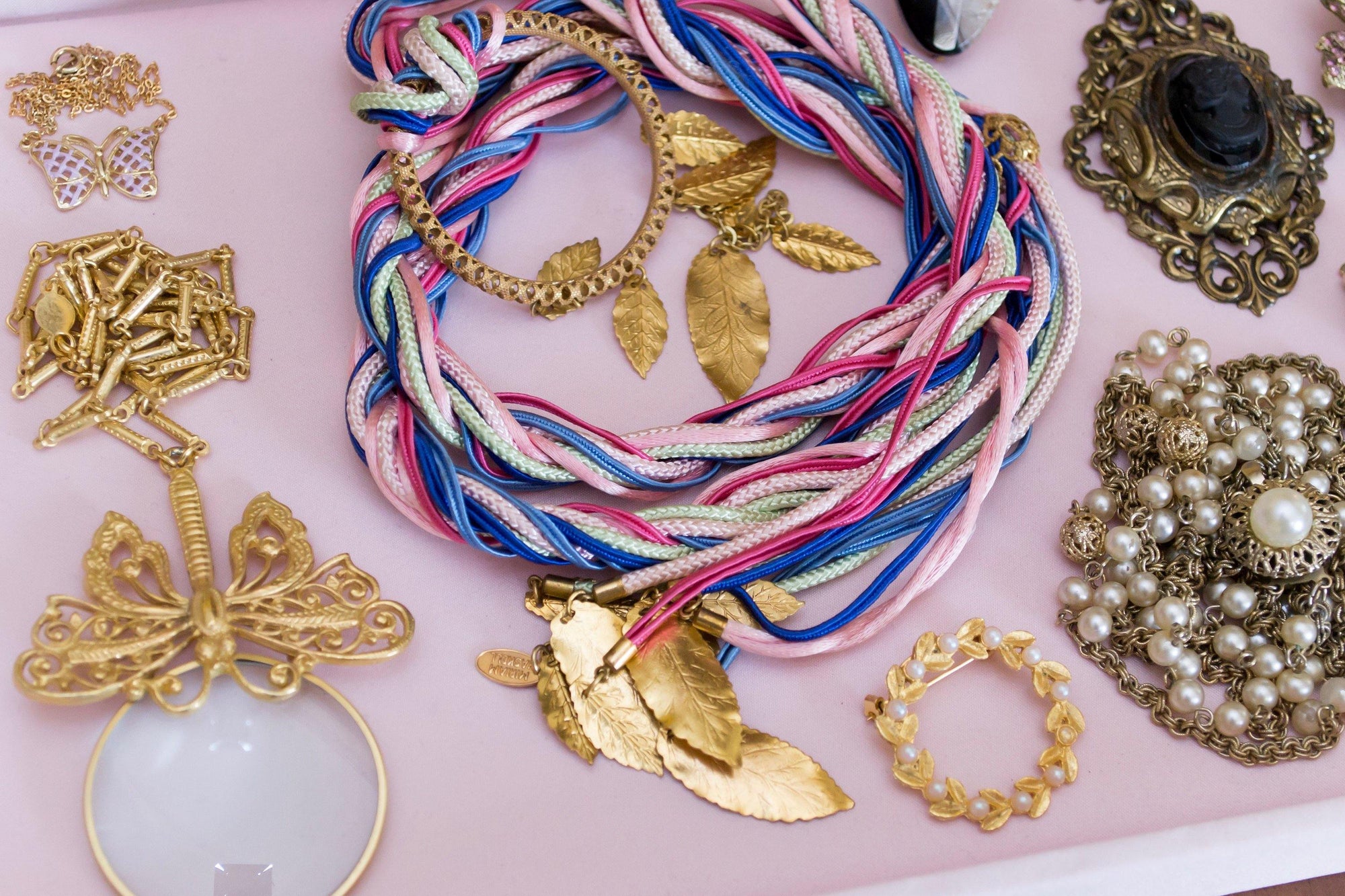 Vintage Miriam Haskell Blue, Pink, Turquoise, Purple Silk Ribbon Belt with Russian Gilt Leaf Charms by Miriam Haskel - Vintage Meet Modern Vintage Jewelry - Chicago, Illinois - #oldhollywoodglamour #vintagemeetmodern #designervintage #jewelrybox #antiquejewelry #vintagejewelry