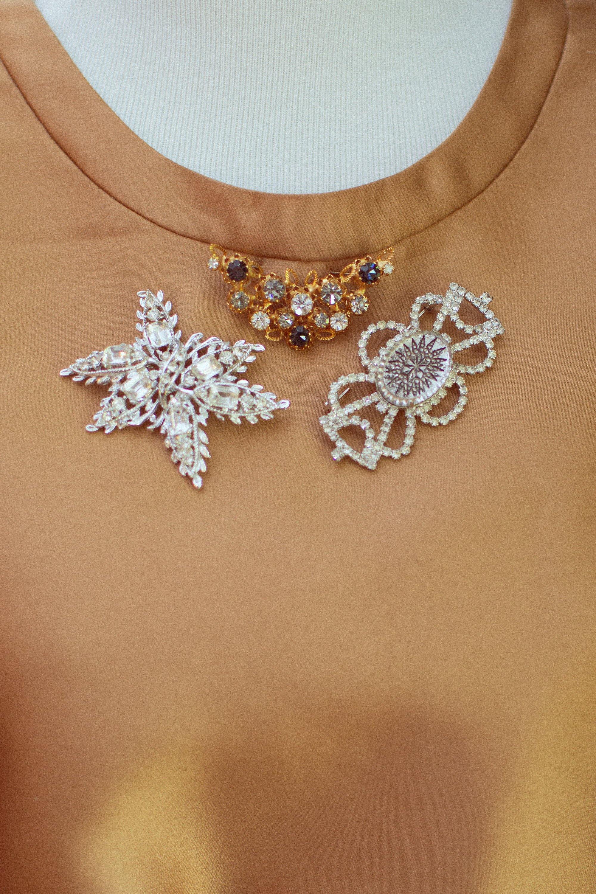 Vintage Made In Austria Gold Filigree Brooch with Diamante, Smoke, and Jet Rhinestone Crystals by 1960s - Vintage Meet Modern Vintage Jewelry - Chicago, Illinois - #oldhollywoodglamour #vintagemeetmodern #designervintage #jewelrybox #antiquejewelry #vintagejewelry