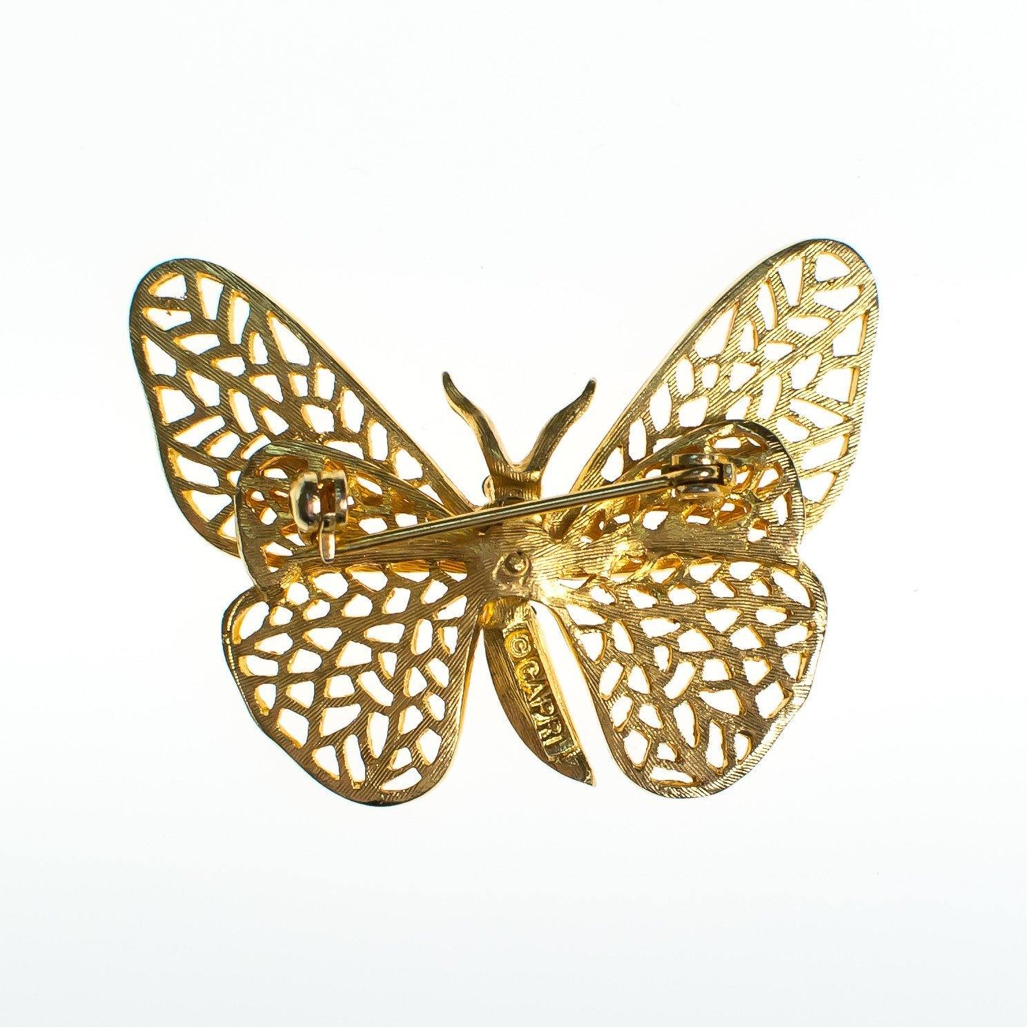 Vintage Capri Gold Butterfly Brooch with Pave Rhinestones and Emerald Crystal Eyes by Capri - Vintage Meet Modern Vintage Jewelry - Chicago, Illinois - #oldhollywoodglamour #vintagemeetmodern #designervintage #jewelrybox #antiquejewelry #vintagejewelry