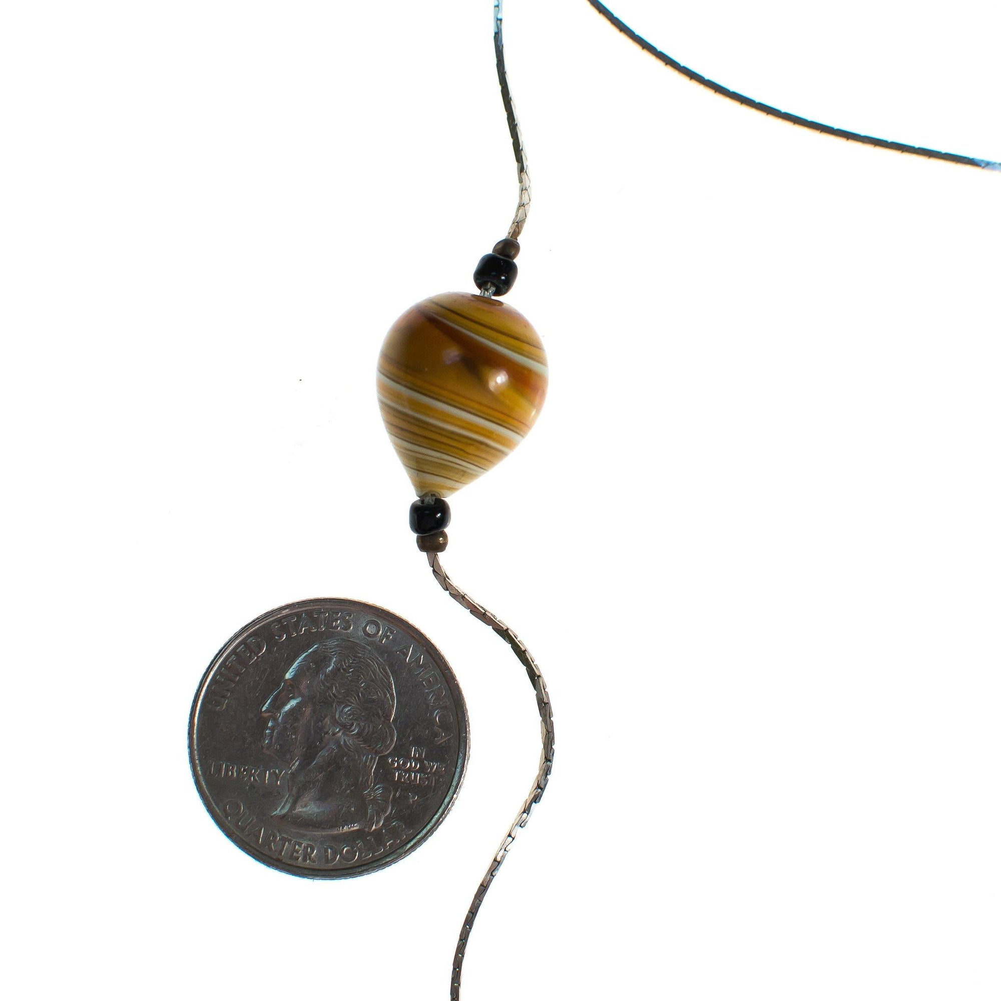 Vintage Sautoir Hand Blown Amber Glass Long Silver Necklace by 1980s - Vintage Meet Modern Vintage Jewelry - Chicago, Illinois - #oldhollywoodglamour #vintagemeetmodern #designervintage #jewelrybox #antiquejewelry #vintagejewelry