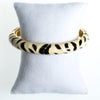 Kenneth Jay Lane Black and White Zebra Bangle Bracelet, Gold Tone by Kenneth Jay Lane - Vintage Meet Modern Vintage Jewelry - Chicago, Illinois - #oldhollywoodglamour #vintagemeetmodern #designervintage #jewelrybox #antiquejewelry #vintagejewelry