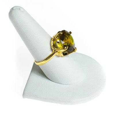 Vintage Olive Green Crystal Rhinestone Statement Ring, Gold Tone, Ring Size 9 by 1980s - Vintage Meet Modern Vintage Jewelry - Chicago, Illinois - #oldhollywoodglamour #vintagemeetmodern #designervintage #jewelrybox #antiquejewelry #vintagejewelry