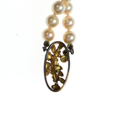 Vintage Faux Pearl Necklace with Sterling Silver Floral Pendant with Garnet, Lapis, and Green Tourmaline by Pearls - Vintage Meet Modern Vintage Jewelry - Chicago, Illinois - #oldhollywoodglamour #vintagemeetmodern #designervintage #jewelrybox #antiquejewelry #vintagejewelry