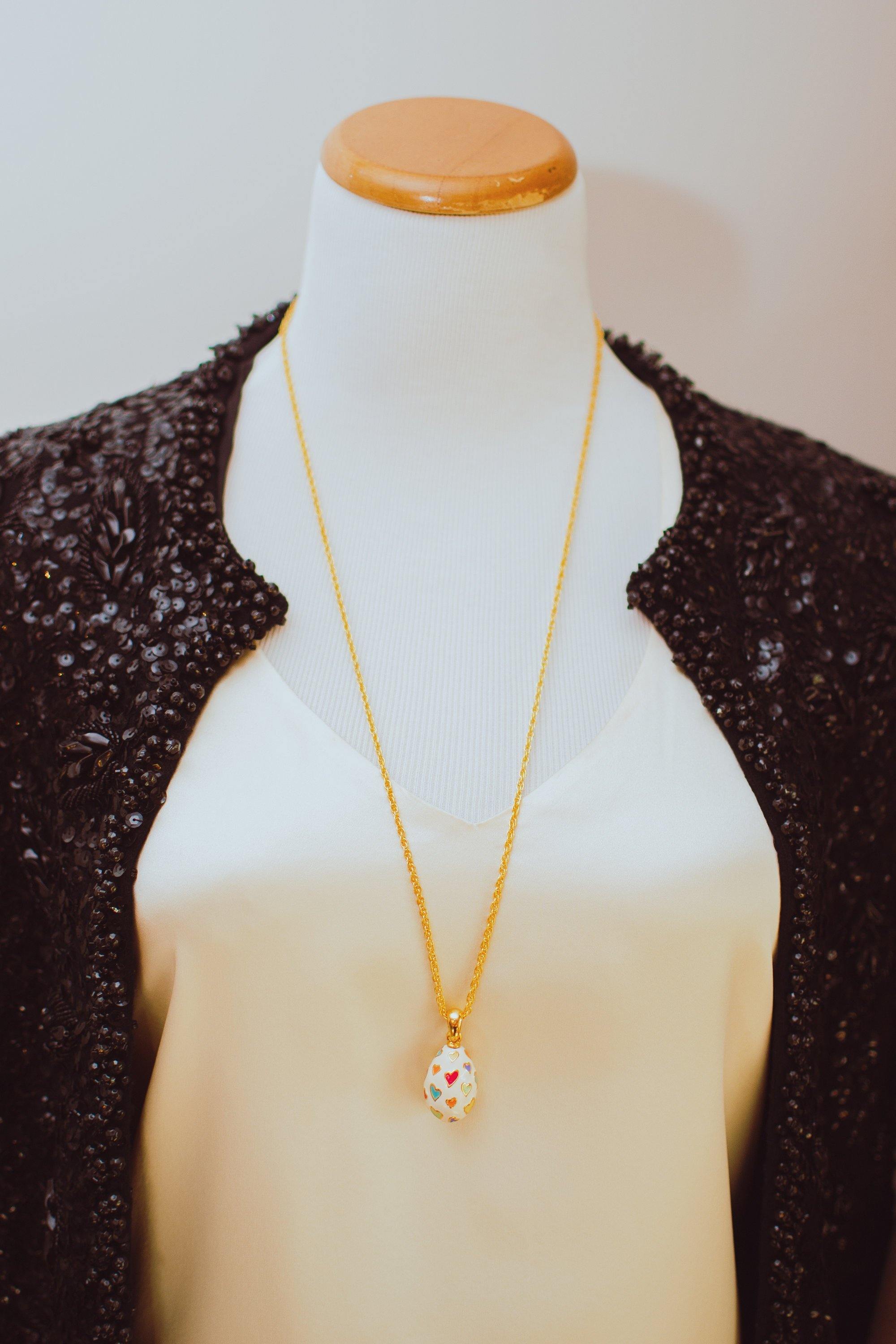Joan Rivers Heart Imperial Egg Pendant, White Pendant with colorful Hearts, Gold Tone Chain, Lobster Clasp by Joan Rivers - Vintage Meet Modern Vintage Jewelry - Chicago, Illinois - #oldhollywoodglamour #vintagemeetmodern #designervintage #jewelrybox #antiquejewelry #vintagejewelry