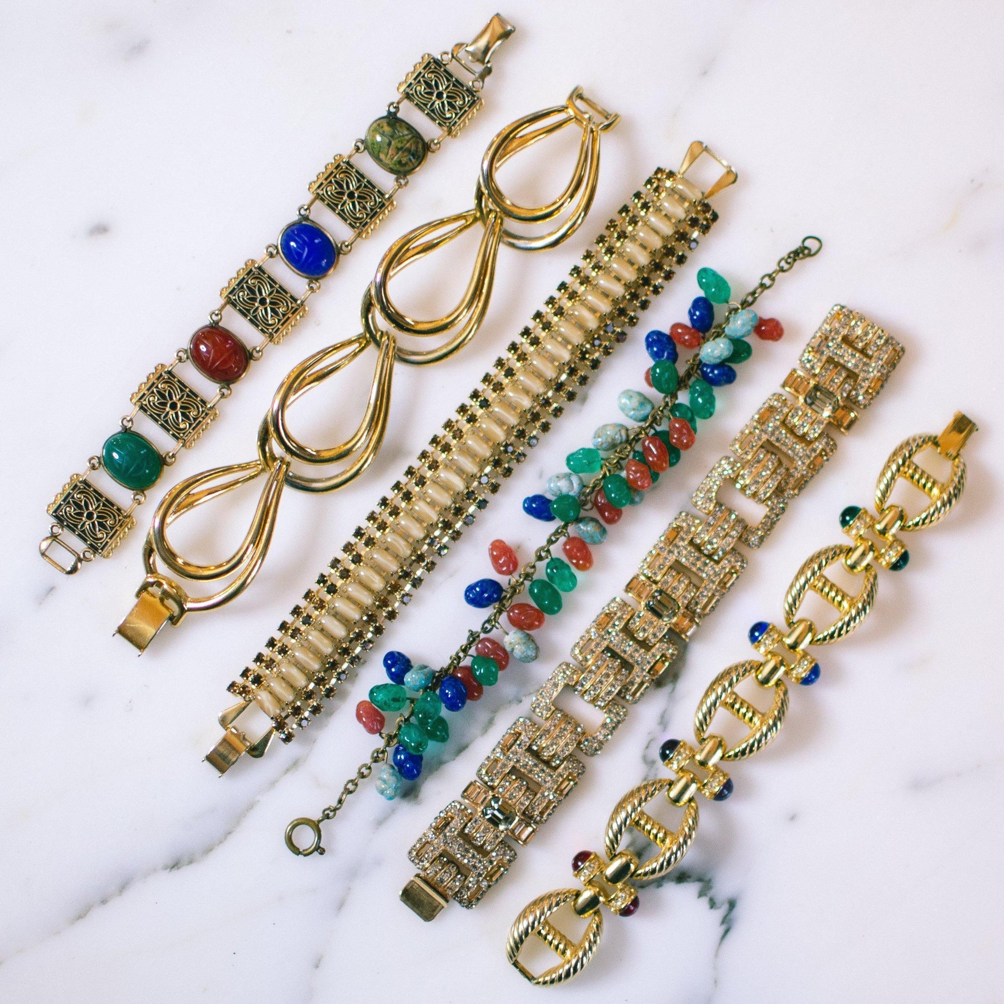 Vintage Gold Cable Bracelet with Red, Purple, Blue, and Green Cabochon Lucite Gems, Gold Tone Setting, Snap Lock Clasp by 1980s - Vintage Meet Modern Vintage Jewelry - Chicago, Illinois - #oldhollywoodglamour #vintagemeetmodern #designervintage #jewelrybox #antiquejewelry #vintagejewelry