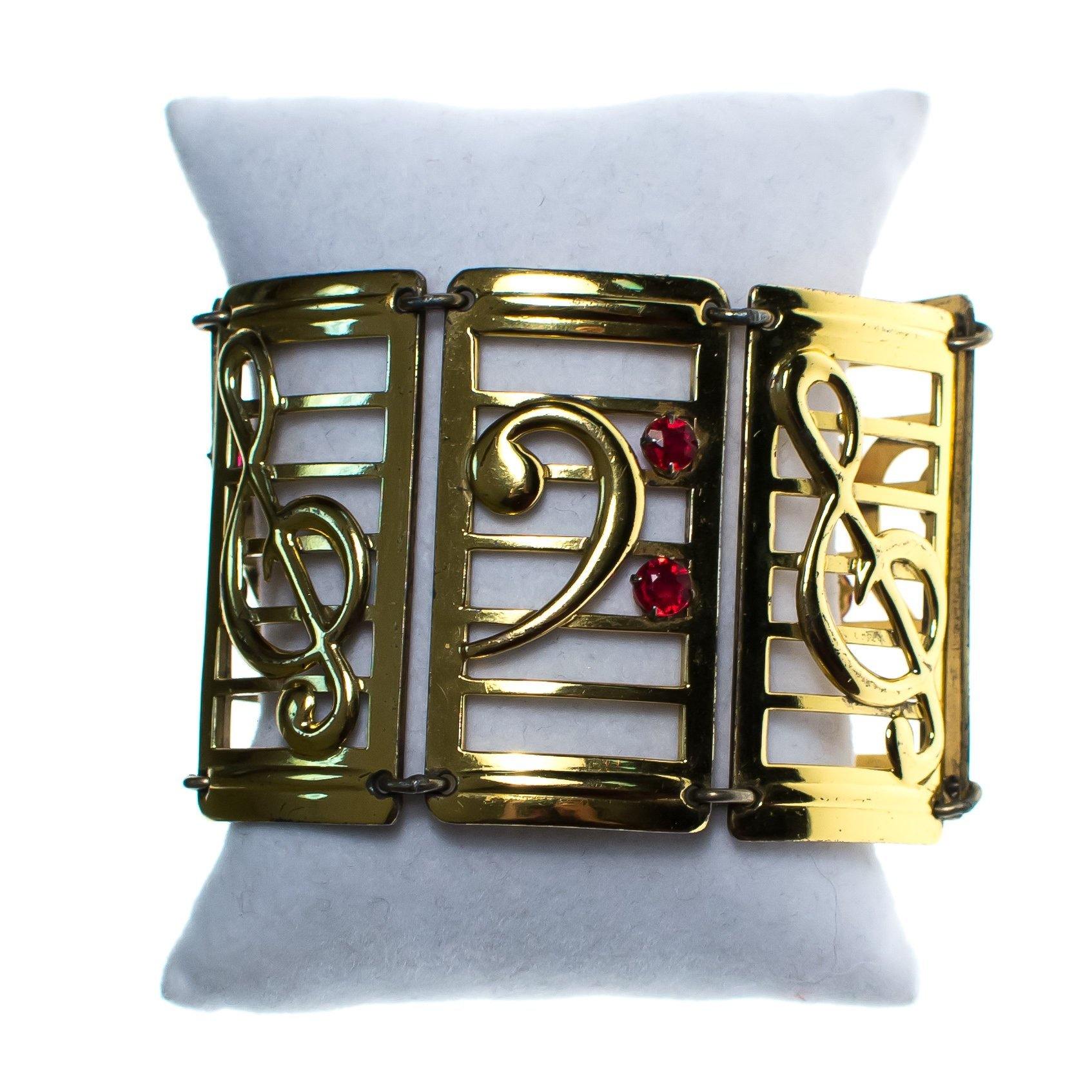 Vintage 1940s Gold and Sterling Silver Wide Panel Music Note Bracelet with Red Rhinestones by 1940s - Vintage Meet Modern Vintage Jewelry - Chicago, Illinois - #oldhollywoodglamour #vintagemeetmodern #designervintage #jewelrybox #antiquejewelry #vintagejewelry