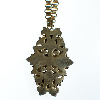Vintage 1940s Repousse Gold Floral Pendant Neckalce with Book Chain by 1940s - Vintage Meet Modern Vintage Jewelry - Chicago, Illinois - #oldhollywoodglamour #vintagemeetmodern #designervintage #jewelrybox #antiquejewelry #vintagejewelry