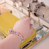 Vintage Coral and White Zebra Bangle Bracelet by 1980s - Vintage Meet Modern Vintage Jewelry - Chicago, Illinois - #oldhollywoodglamour #vintagemeetmodern #designervintage #jewelrybox #antiquejewelry #vintagejewelry