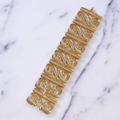 Vintage Kenneth Jay Lane Wide Panel Gold Scroll Bracelet by Kenneth Jay Lane - Vintage Meet Modern Vintage Jewelry - Chicago, Illinois - #oldhollywoodglamour #vintagemeetmodern #designervintage #jewelrybox #antiquejewelry #vintagejewelry