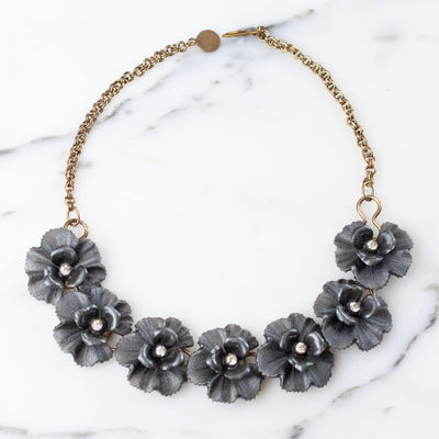 Vintage Grey Lucite Flower Necklace with Rhinestones Center by 1950s - Vintage Meet Modern Vintage Jewelry - Chicago, Illinois - #oldhollywoodglamour #vintagemeetmodern #designervintage #jewelrybox #antiquejewelry #vintagejewelry