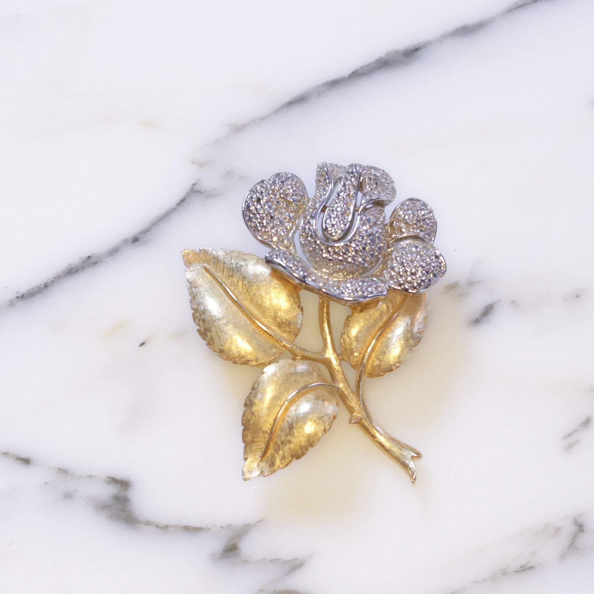 Vintage Crown Trifari Silver Milgrain Rose with Gold Leaves Brooch by Crown Trifari - Vintage Meet Modern Vintage Jewelry - Chicago, Illinois - #oldhollywoodglamour #vintagemeetmodern #designervintage #jewelrybox #antiquejewelry #vintagejewelry