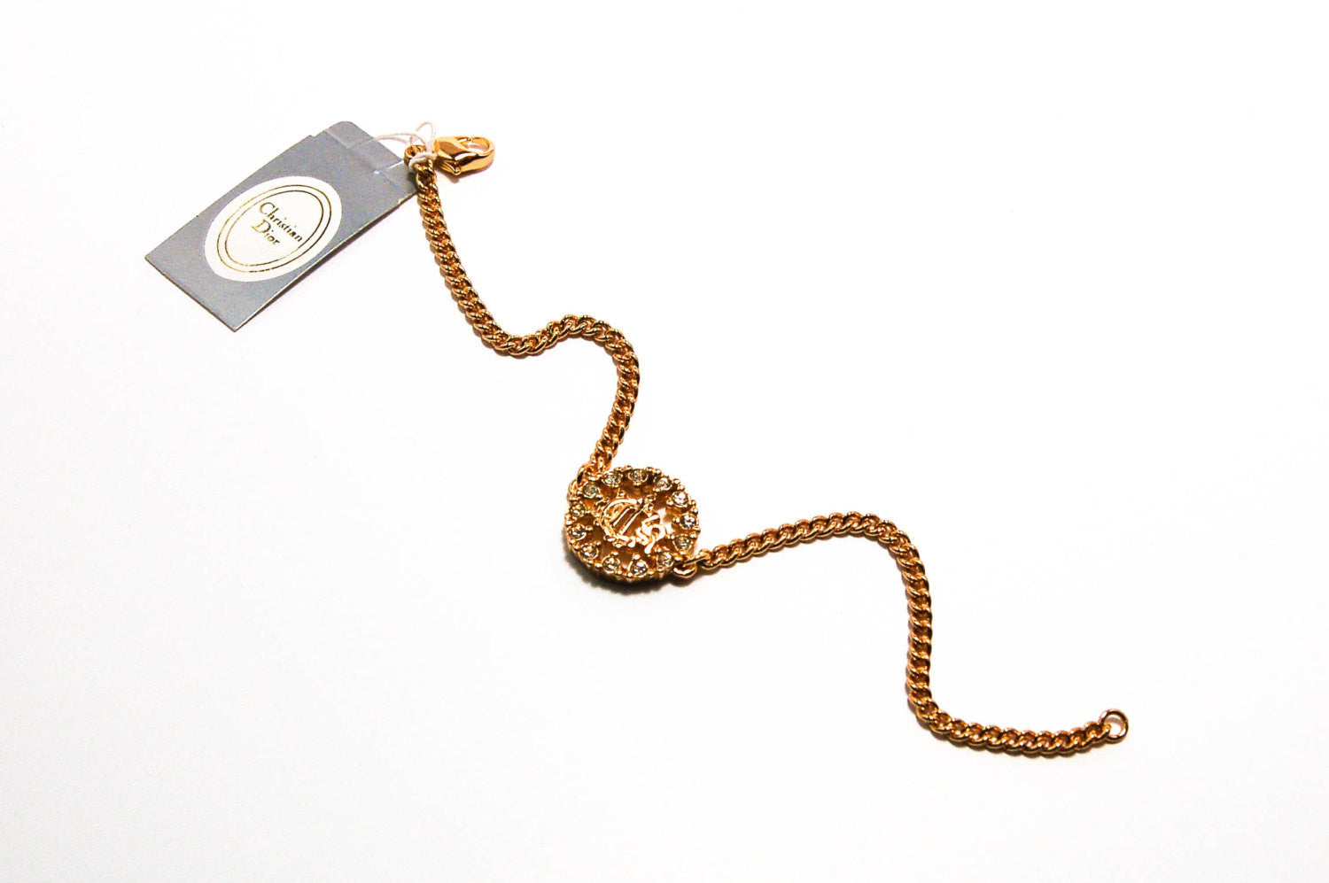 Gold Tone Petite Logo Bracelet by Christian Dior by Christian Dior - Vintage Meet Modern Vintage Jewelry - Chicago, Illinois - #oldhollywoodglamour #vintagemeetmodern #designervintage #jewelrybox #antiquejewelry #vintagejewelry