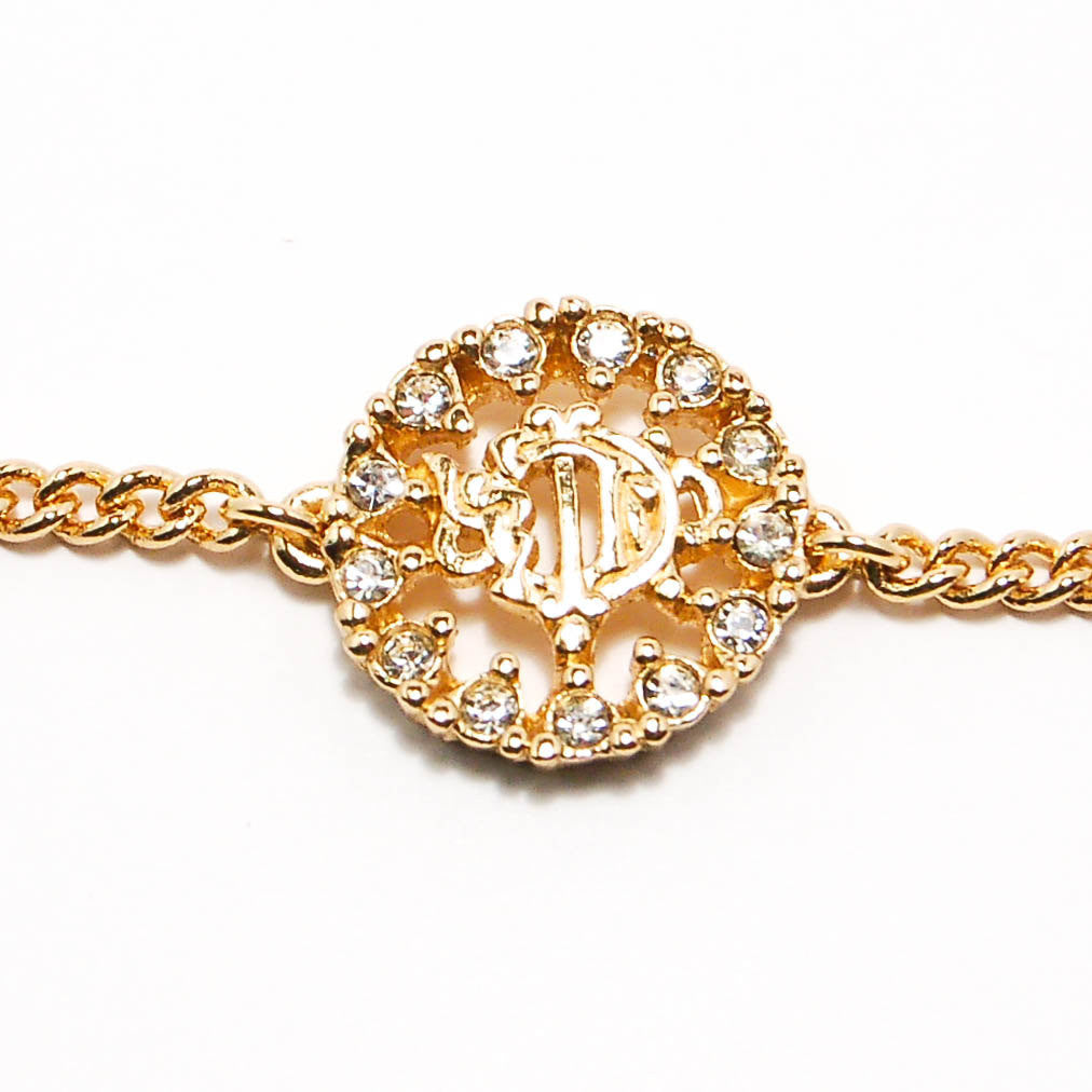 Gold Tone Petite Logo Bracelet by Christian Dior by Christian Dior - Vintage Meet Modern Vintage Jewelry - Chicago, Illinois - #oldhollywoodglamour #vintagemeetmodern #designervintage #jewelrybox #antiquejewelry #vintagejewelry