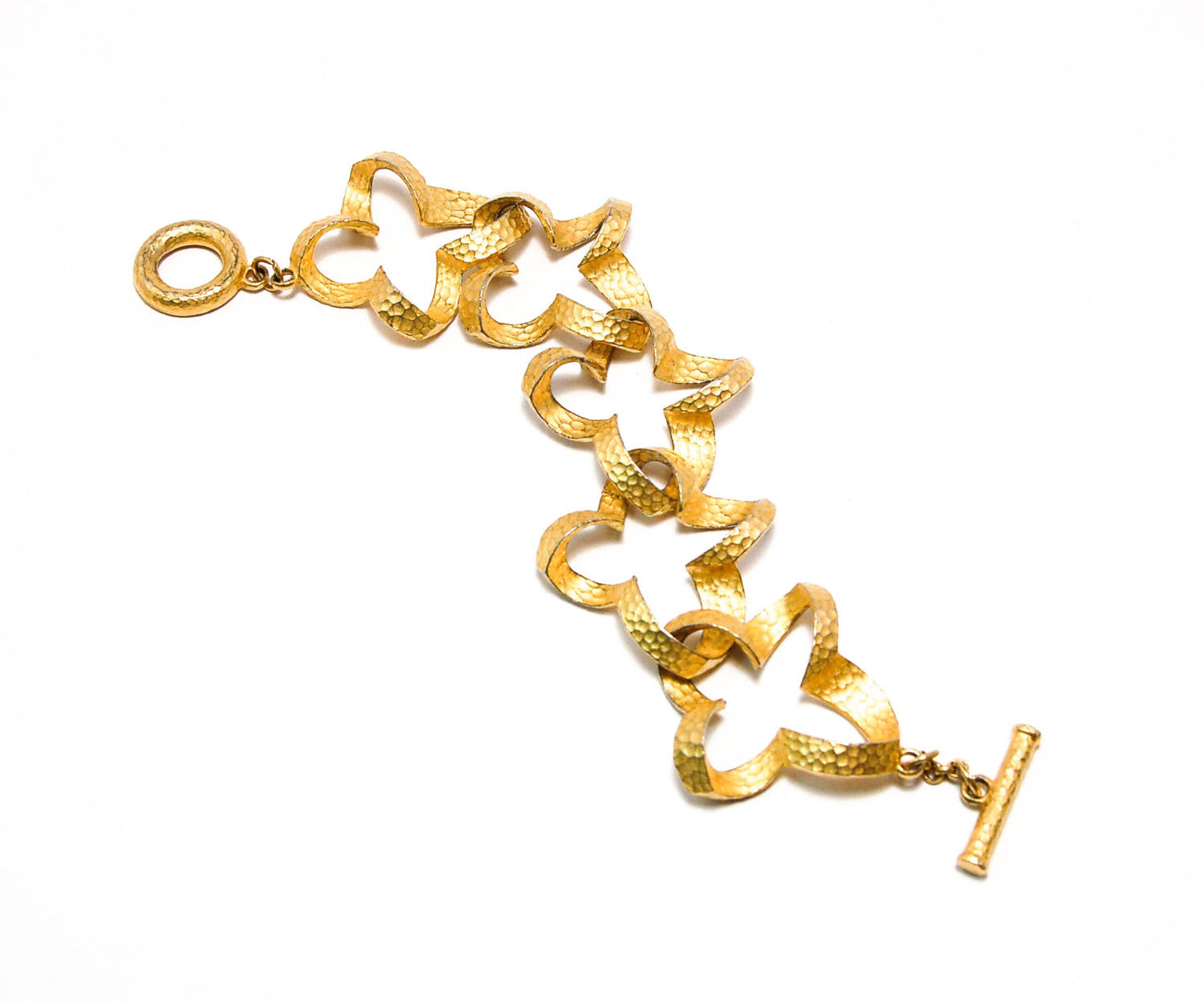 Gold Tone Quatrefoil Link Bracelet by Givenchy by Givenchy - Vintage Meet Modern Vintage Jewelry - Chicago, Illinois - #oldhollywoodglamour #vintagemeetmodern #designervintage #jewelrybox #antiquejewelry #vintagejewelry