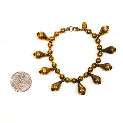 1970's Embossed Brass Charm Bracelet by DVF by Diane Von Furstenberg - Vintage Meet Modern Vintage Jewelry - Chicago, Illinois - #oldhollywoodglamour #vintagemeetmodern #designervintage #jewelrybox #antiquejewelry #vintagejewelry
