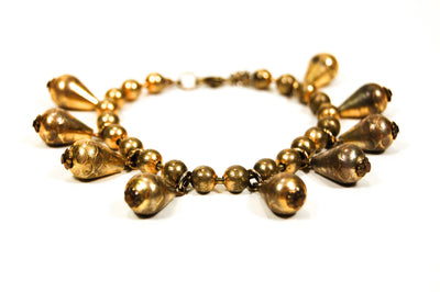 1970's Embossed Brass Charm Bracelet by DVF by Diane Von Furstenberg - Vintage Meet Modern Vintage Jewelry - Chicago, Illinois - #oldhollywoodglamour #vintagemeetmodern #designervintage #jewelrybox #antiquejewelry #vintagejewelry
