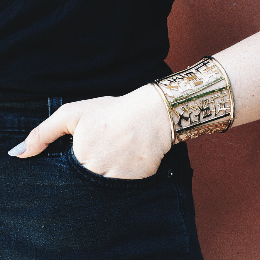 Wide Gold Tone Asian Theme Cuff Bracelet by Napier by Napier - Vintage Meet Modern Vintage Jewelry - Chicago, Illinois - #oldhollywoodglamour #vintagemeetmodern #designervintage #jewelrybox #antiquejewelry #vintagejewelry
