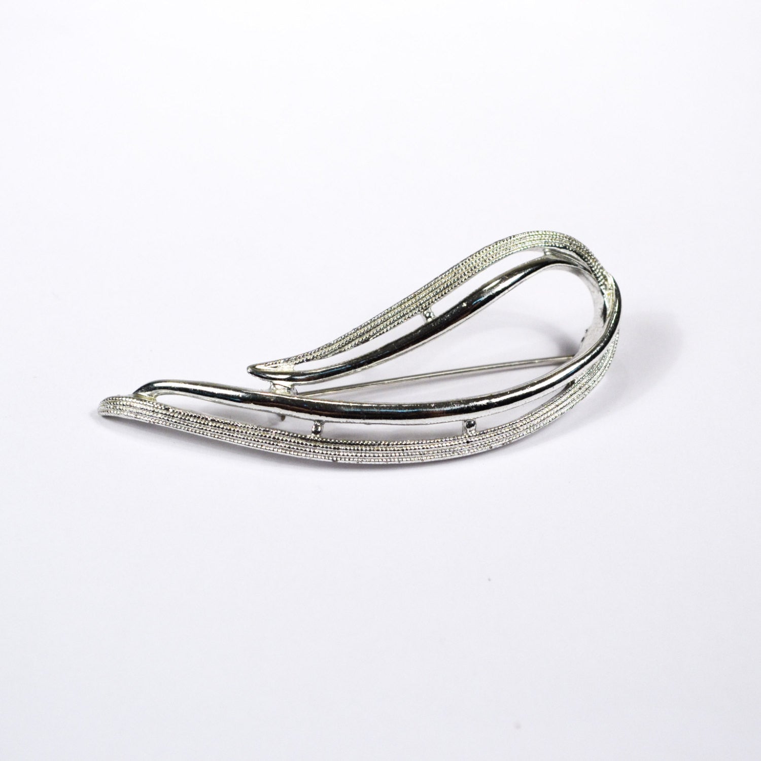 Sarah Coventry Silver Brooch, Open Wave Design, 1970s Designer Jewelry by Sarah Coventry - Vintage Meet Modern Vintage Jewelry - Chicago, Illinois - #oldhollywoodglamour #vintagemeetmodern #designervintage #jewelrybox #antiquejewelry #vintagejewelry