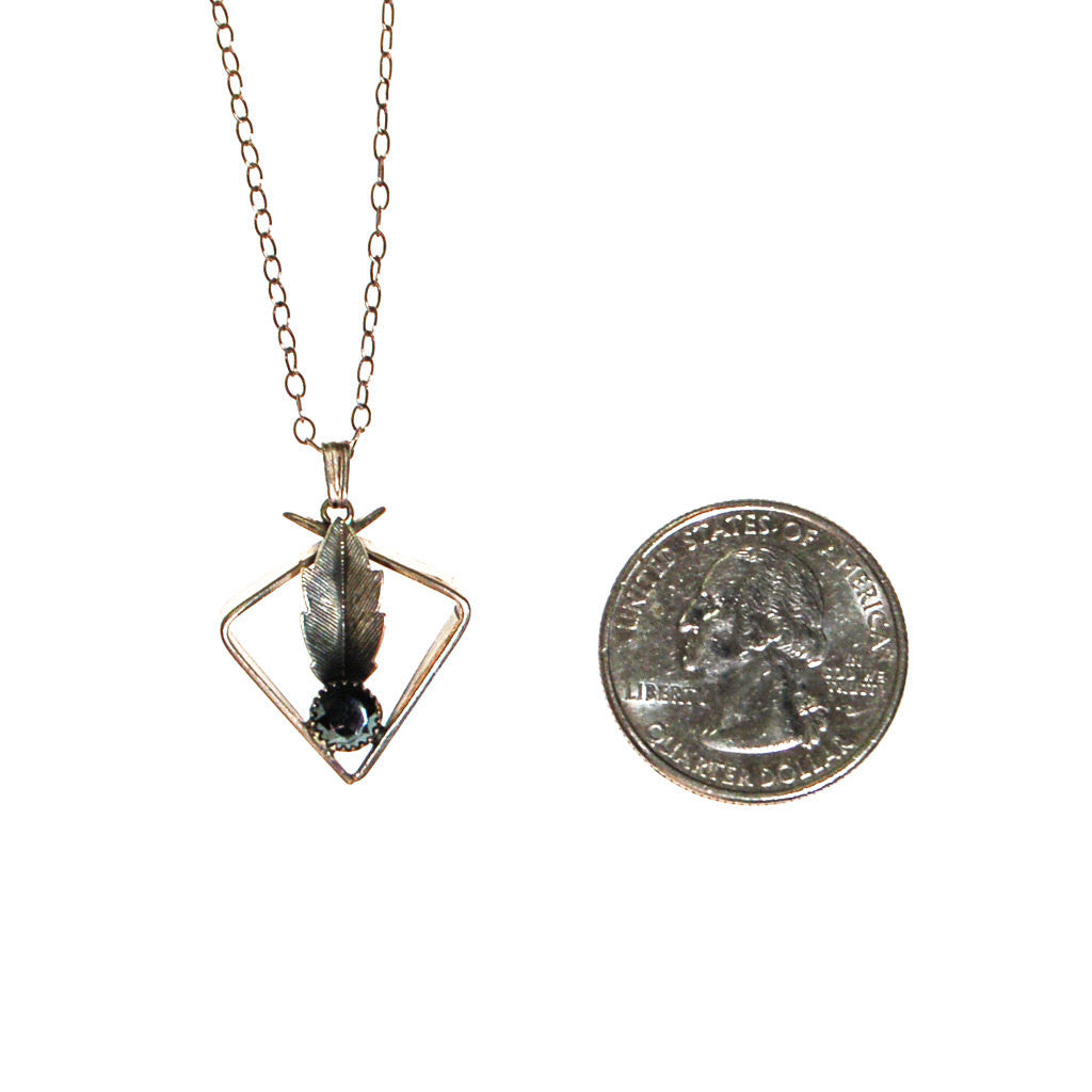 Minimalist and Mod Hematite and Feather Pendant Necklace by Unsigned Beauty - Vintage Meet Modern Vintage Jewelry - Chicago, Illinois - #oldhollywoodglamour #vintagemeetmodern #designervintage #jewelrybox #antiquejewelry #vintagejewelry
