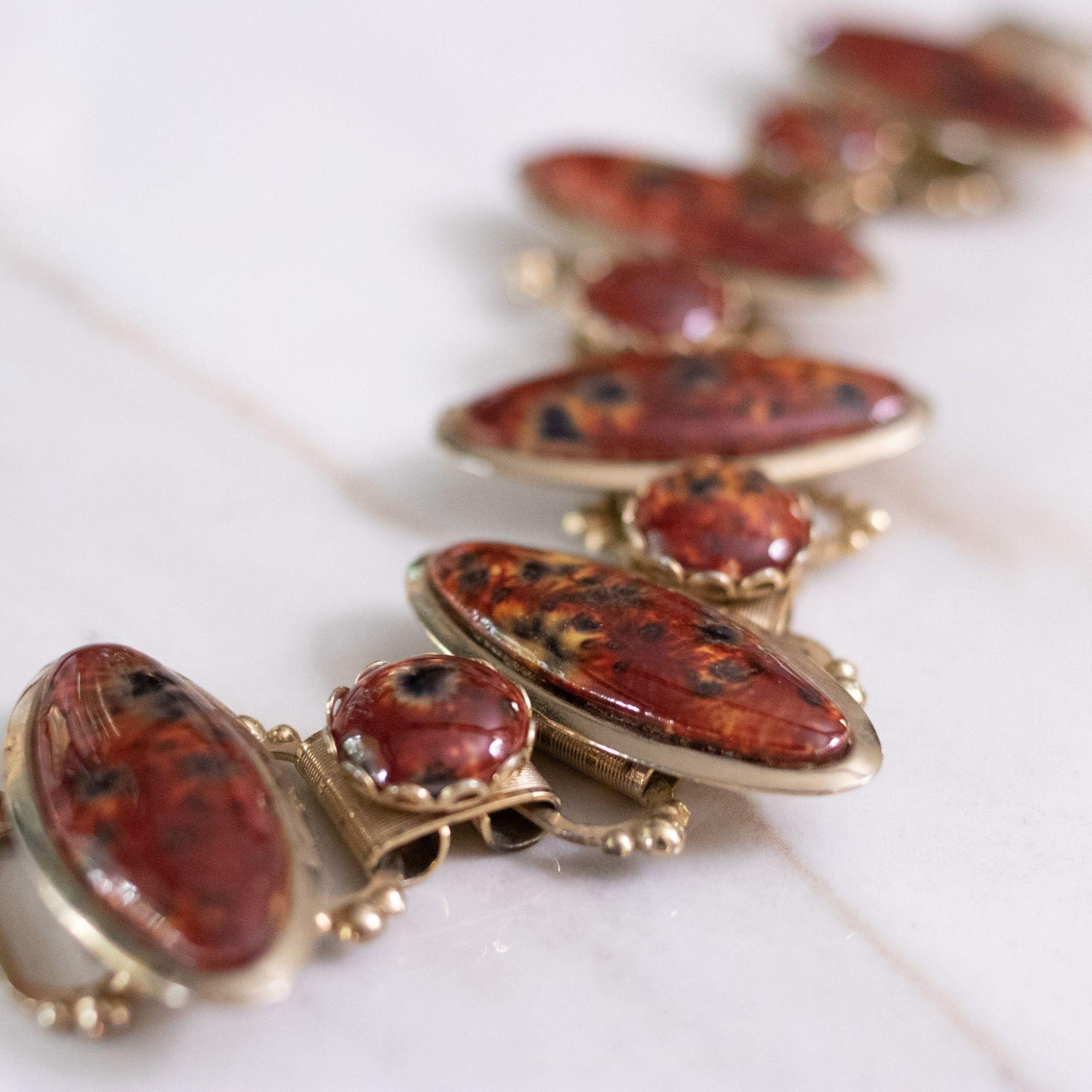 Vintage Marbled Red Glass Cabochon Book Chain Link Bracelet by Unsigned Beauty - Vintage Meet Modern Vintage Jewelry - Chicago, Illinois - #oldhollywoodglamour #vintagemeetmodern #designervintage #jewelrybox #antiquejewelry #vintagejewelry