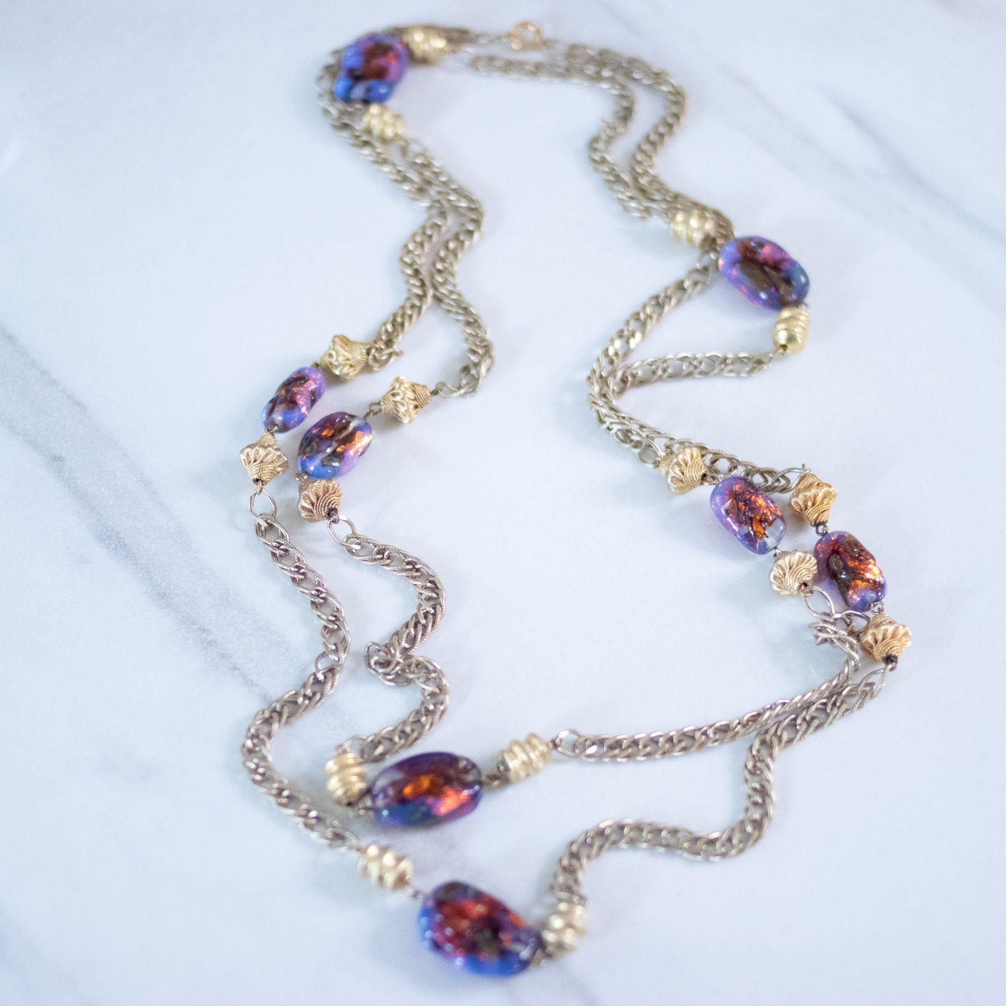 Vintage 1950s Flapper Length Gold and Purple Iridescent Art Glass Necklace by Unsigned Beauty - Vintage Meet Modern Vintage Jewelry - Chicago, Illinois - #oldhollywoodglamour #vintagemeetmodern #designervintage #jewelrybox #antiquejewelry #vintagejewelry