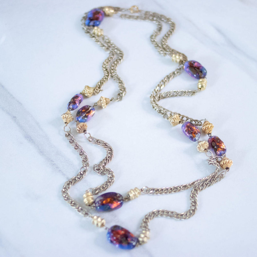 Vintage 1950s Flapper Length Gold and Purple Iridescent Art Glass Necklace by Unsigned Beauty - Vintage Meet Modern Vintage Jewelry - Chicago, Illinois - #oldhollywoodglamour #vintagemeetmodern #designervintage #jewelrybox #antiquejewelry #vintagejewelry