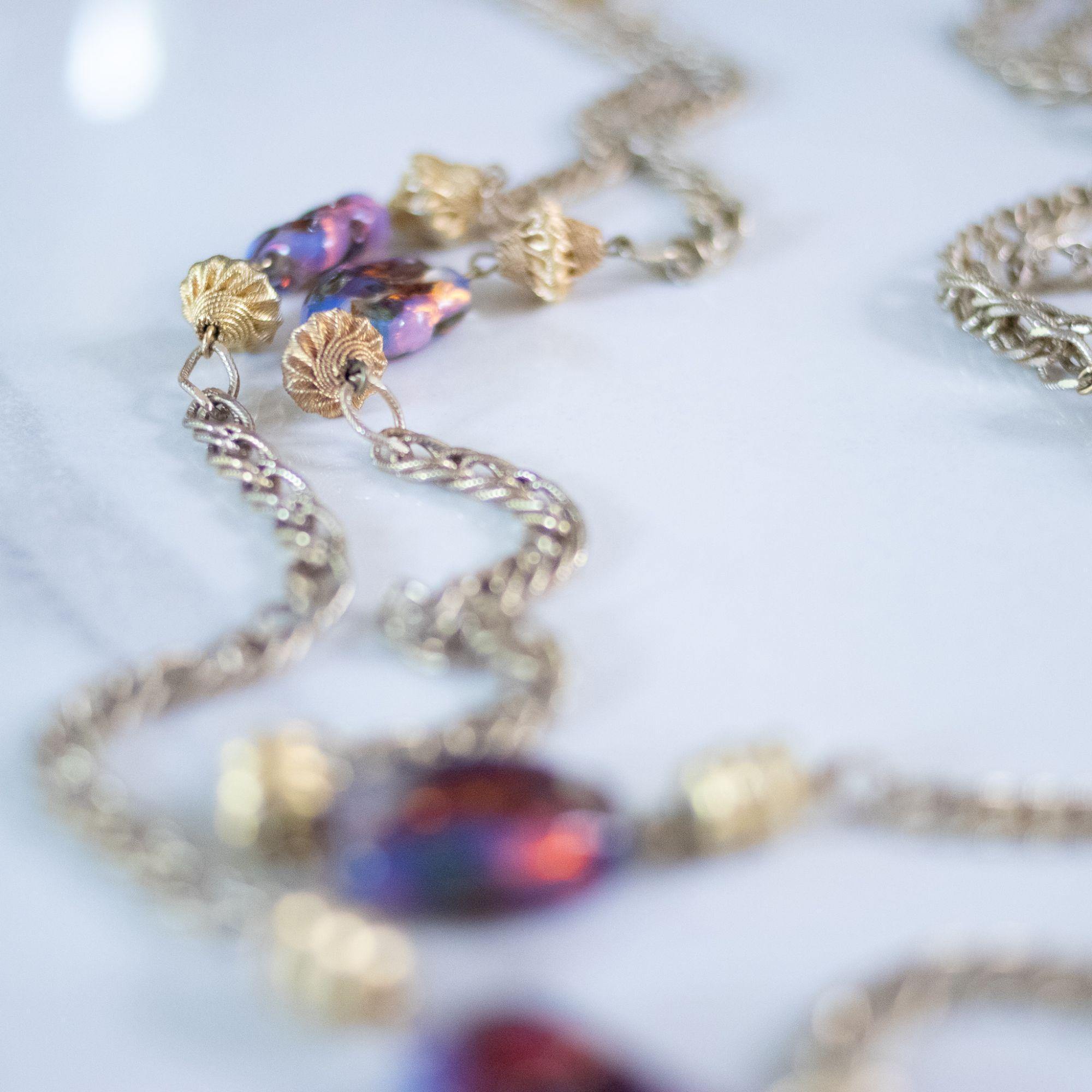 Vintage 1950s Flapper Length Gold and Purple Iridescent Art Glass Necklace by Unsigned Beauty - Vintage Meet Modern Vintage Jewelry - Chicago, Illinois - #oldhollywoodglamour #vintagemeetmodern #designervintage #jewelrybox #antiquejewelry #vintagejewelry