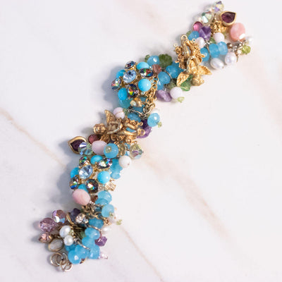 Vintage Kirks Folly Loaded Charm Bracelet with Cherubs, Crystals, Blue Turquoise Beads by Kirks Folly - Vintage Meet Modern Vintage Jewelry - Chicago, Illinois - #oldhollywoodglamour #vintagemeetmodern #designervintage #jewelrybox #antiquejewelry #vintagejewelry