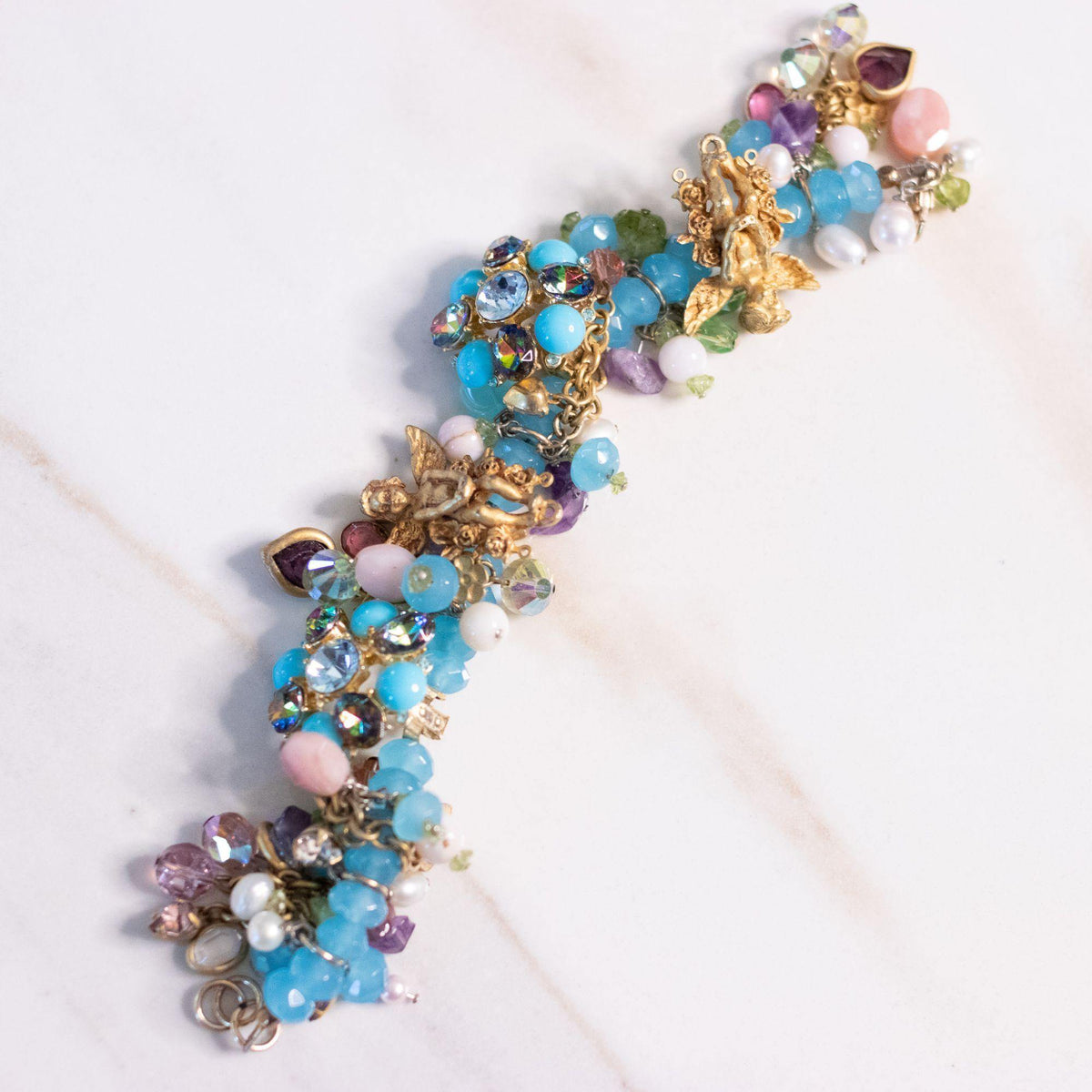 Vintage Kirks Folly Loaded Charm Bracelet with Cherubs, Crystals, Blue Turquoise Beads