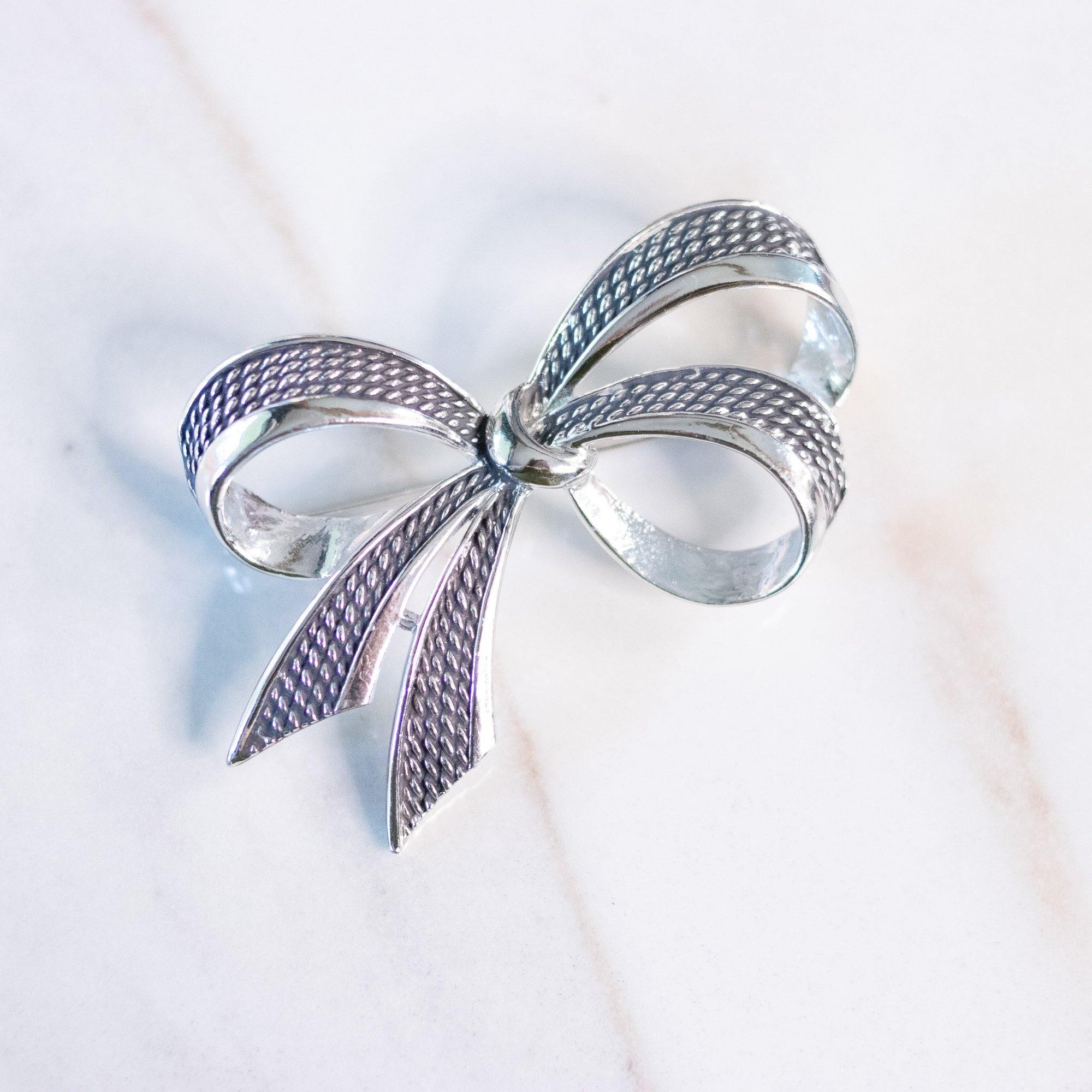 Vintage Boucher Silver Bow Brooch by Boucher - Vintage Meet Modern Vintage Jewelry - Chicago, Illinois - #oldhollywoodglamour #vintagemeetmodern #designervintage #jewelrybox #antiquejewelry #vintagejewelry