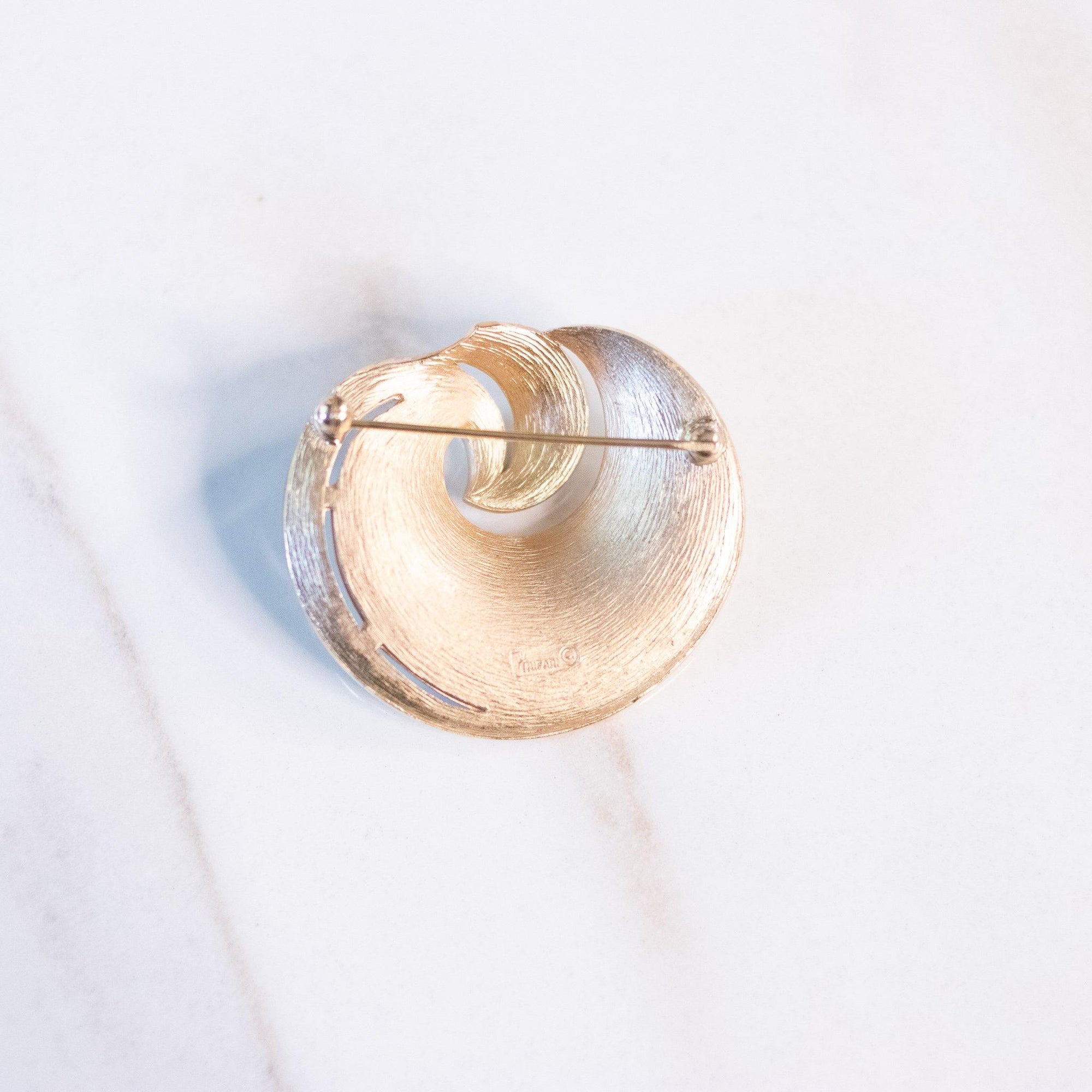 Vintage Crown Trifari White Enamel and Gold Swirl Mid Century Modern Brooch by Crown Trifari - Vintage Meet Modern Vintage Jewelry - Chicago, Illinois - #oldhollywoodglamour #vintagemeetmodern #designervintage #jewelrybox #antiquejewelry #vintagejewelry