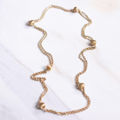 Vintage Gold Fluted Bead Long Necklace by Unsigned Beauty - Vintage Meet Modern Vintage Jewelry - Chicago, Illinois - #oldhollywoodglamour #vintagemeetmodern #designervintage #jewelrybox #antiquejewelry #vintagejewelry