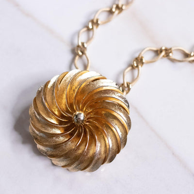 Vintage Mid Century Modern Gold Spiral Medallion Brooch/Pendant Necklace by Unsigned Beauty - Vintage Meet Modern Vintage Jewelry - Chicago, Illinois - #oldhollywoodglamour #vintagemeetmodern #designervintage #jewelrybox #antiquejewelry #vintagejewelry