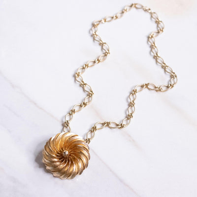 Vintage Mid Century Modern Gold Spiral Medallion Brooch/Pendant Necklace by Unsigned Beauty - Vintage Meet Modern Vintage Jewelry - Chicago, Illinois - #oldhollywoodglamour #vintagemeetmodern #designervintage #jewelrybox #antiquejewelry #vintagejewelry