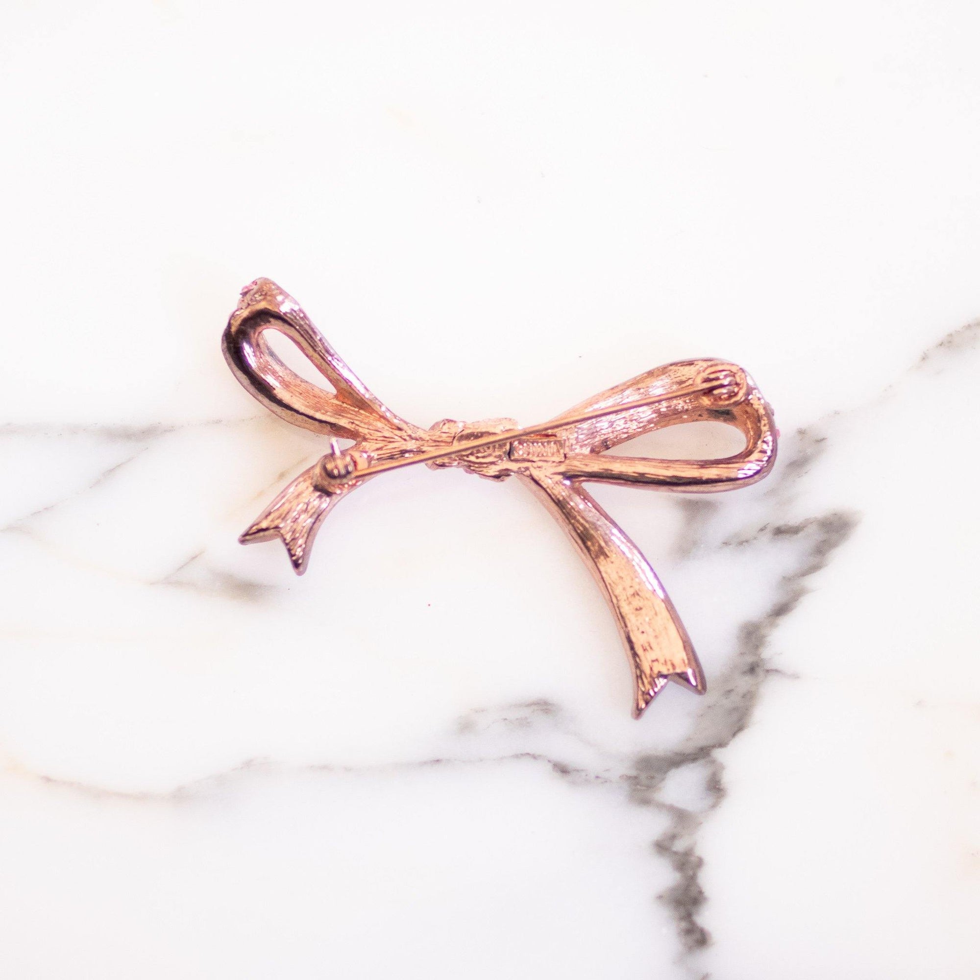Vintage KJL Pink Rhinestone Ribbon Bow Brooch by Kenneth Jay Lane - Vintage Meet Modern Vintage Jewelry - Chicago, Illinois - #oldhollywoodglamour #vintagemeetmodern #designervintage #jewelrybox #antiquejewelry #vintagejewelry