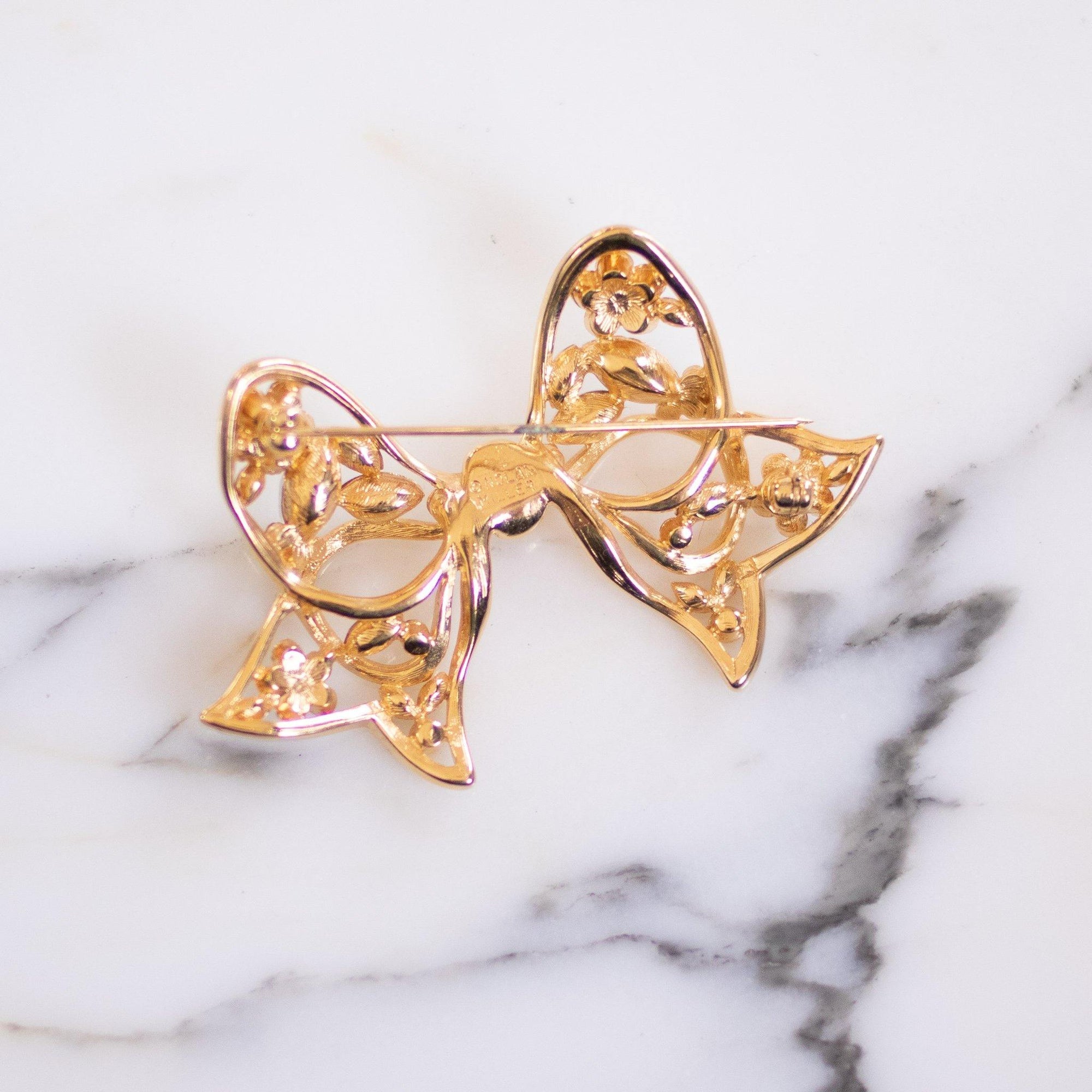 Vintage Nolan Miller Gold Bow with Rhinestones Brooch by Nolan Miller - Vintage Meet Modern Vintage Jewelry - Chicago, Illinois - #oldhollywoodglamour #vintagemeetmodern #designervintage #jewelrybox #antiquejewelry #vintagejewelry