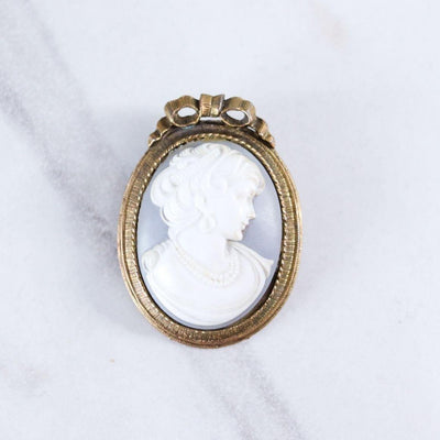 Vintage Blue and White Wedgewood Cameo Brooch with Gold Frame with Ribbon by Unsigned Beauty - Vintage Meet Modern Vintage Jewelry - Chicago, Illinois - #oldhollywoodglamour #vintagemeetmodern #designervintage #jewelrybox #antiquejewelry #vintagejewelry