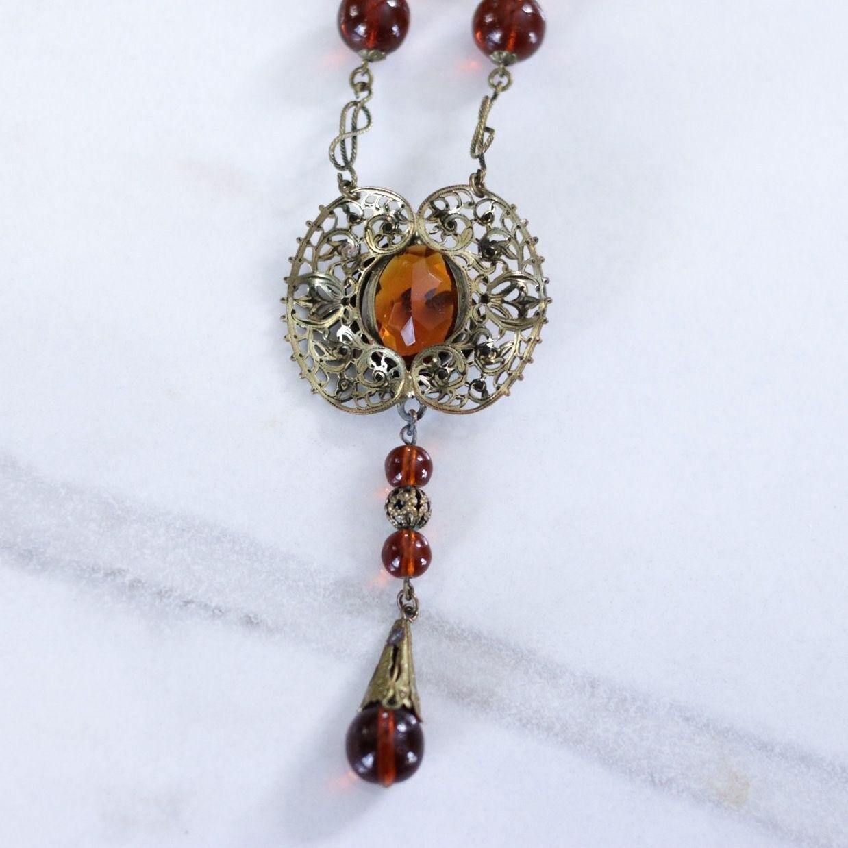Vintage Long Art Deco Amber Glass Necklace with Brass Accent with Serpent by Czech - Vintage Meet Modern Vintage Jewelry - Chicago, Illinois - #oldhollywoodglamour #vintagemeetmodern #designervintage #jewelrybox #antiquejewelry #vintagejewelry